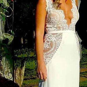 Wedding Dress size 4, lace is see through, only worn once for an hour!